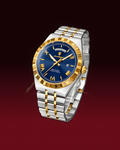 A two-tone stainless steel and gold-tone wristwatch with a deep blue dial, Roman numeral hour markers, and a date window, shown on a dark red gradient background.