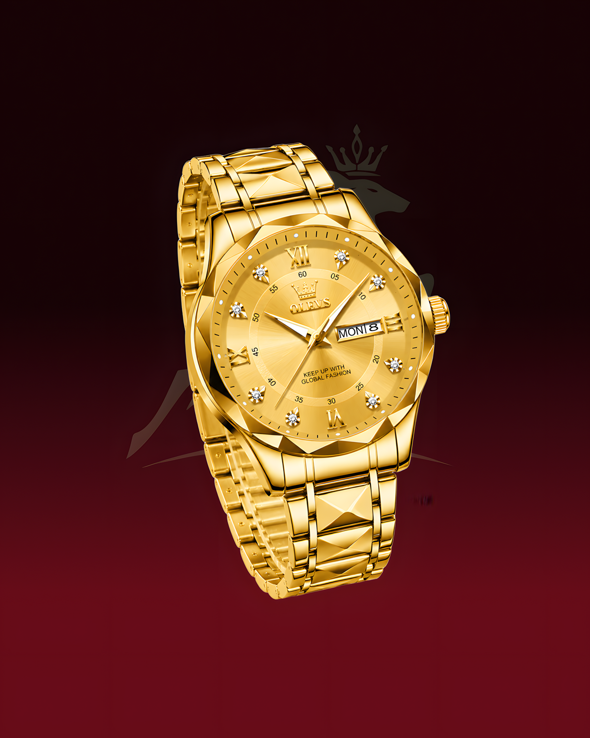 A gold-tone stainless steel watch with a matching link bracelet, featuring a textured gold dial, crystal hour markers, and a day/date window at 3 o'clock, set against a dark red gradient background.