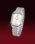A silver-tone metal link watch with an octagonal bezel, a white dial, and gold-tone hands and markers, shown floating against a dark red gradient background. The brand name 'Mehulax' is visible on the dial.